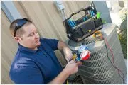 man doing maintenance on HVAC